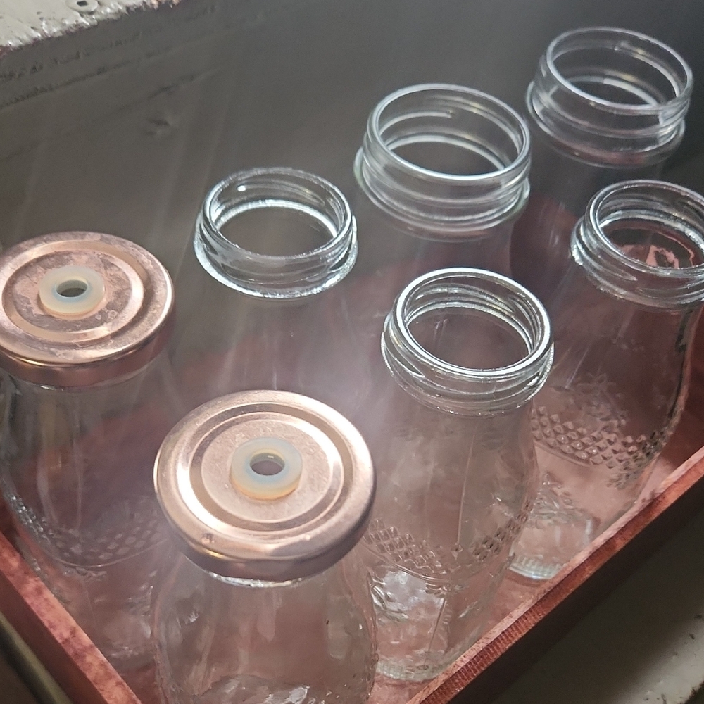 Set of Clear Glass Bottles with Copper Lids